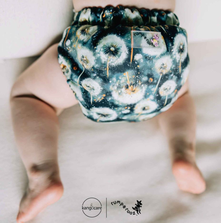 Baby wearing a cloth diaper from Kanga Care