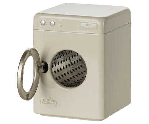 A miniature cream-colored toy washing machine with a silver metal door frame and a perforated stainless steel drum, shown against a gray and white checkerboard background.
