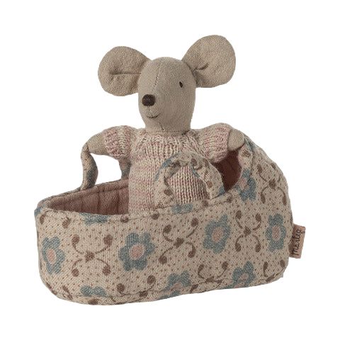 Stuffed mouse toy in a floral-patterned carrier on a transparent background