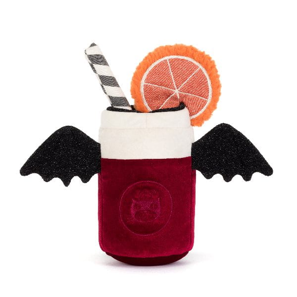 A plush vampire drink toy featuring a deep red velvet-textured body, black bat wings, a white foam top, a black-and-white striped straw, and an orange slice garnish, shown on a plain white background.