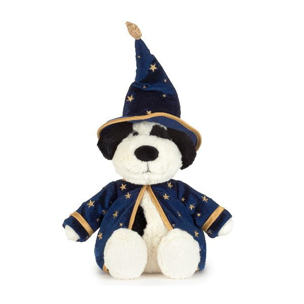 A plush dog toy dressed as a wizard, wearing a navy blue pointed hat and matching robe with gold star patterns and trim, on a plain white background.