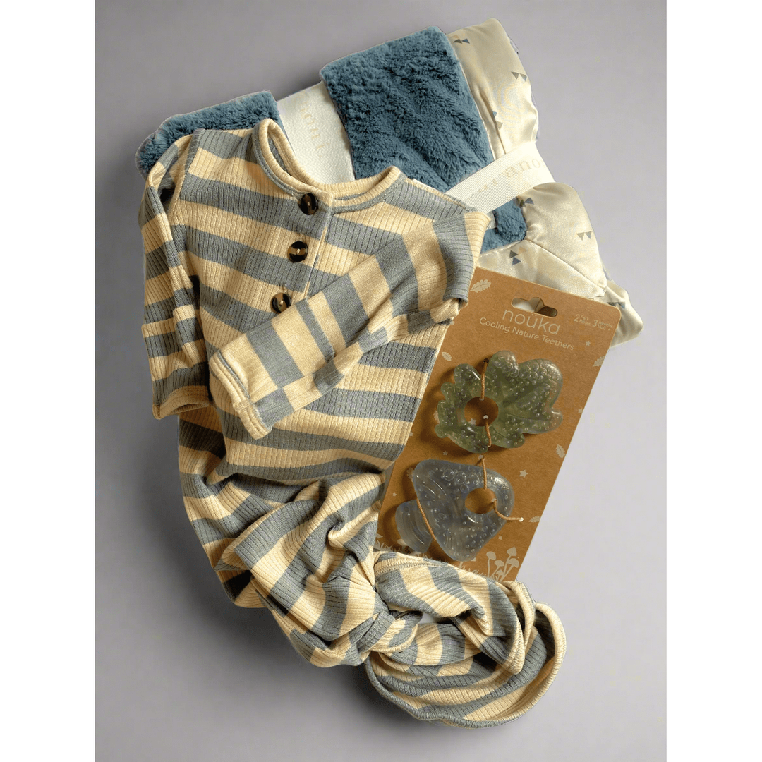 Baby outfit with stripes,blue blanket, white background
