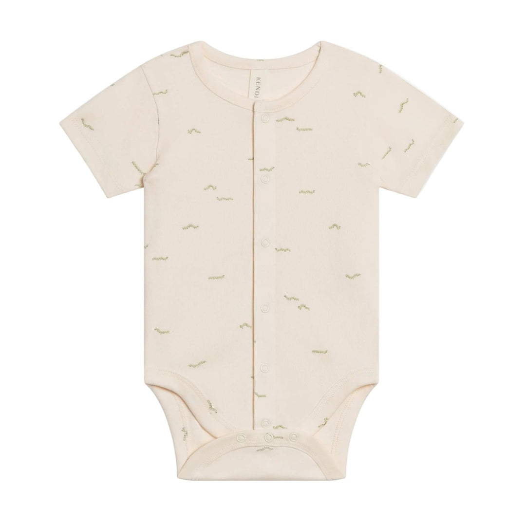 Beige baby onesie with short sleeves on a white background