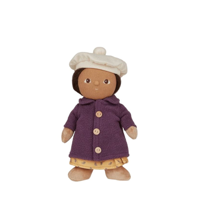 Toy doll wearing a purple coat and white hat on a light gray background