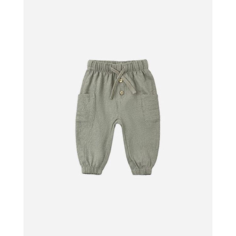 A pair of baby jogger pants in sage green, featuring an elastic waistband with a drawstring, two front patch pockets, and elastic cuffs at the ankles, shown against a plain light gray background.