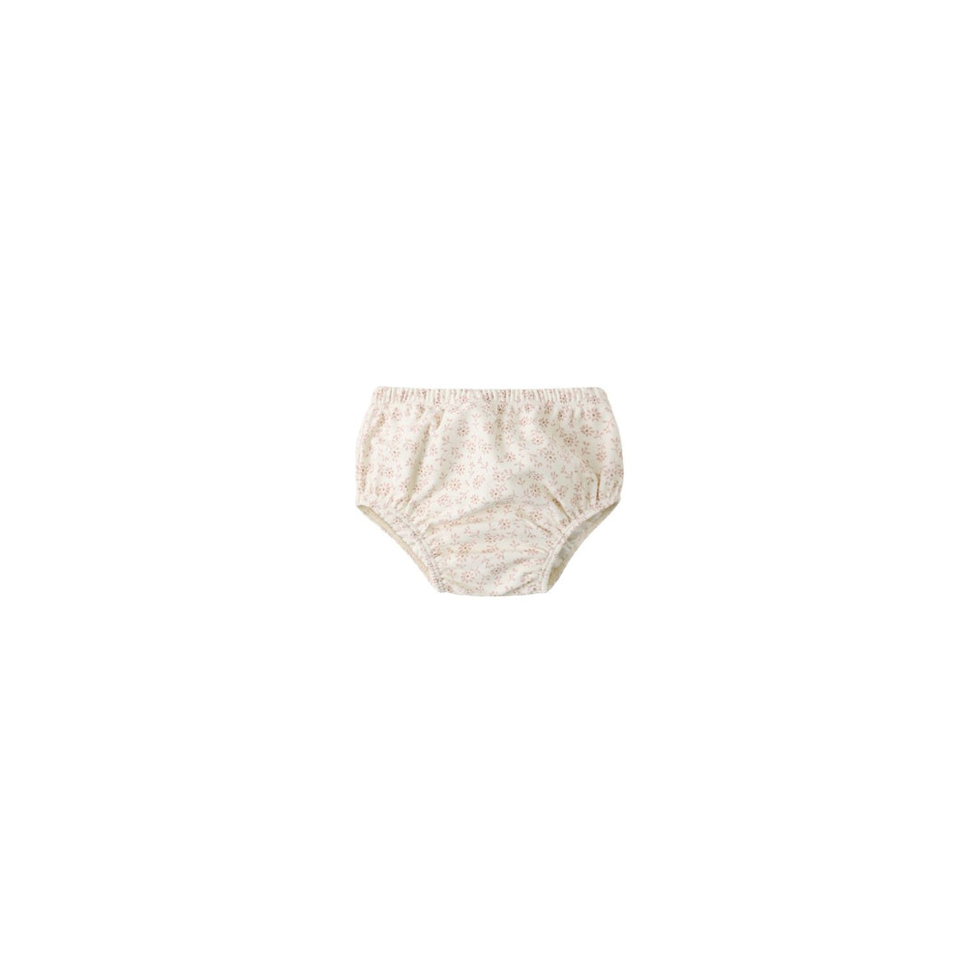 Beige baby bloomers on a white background