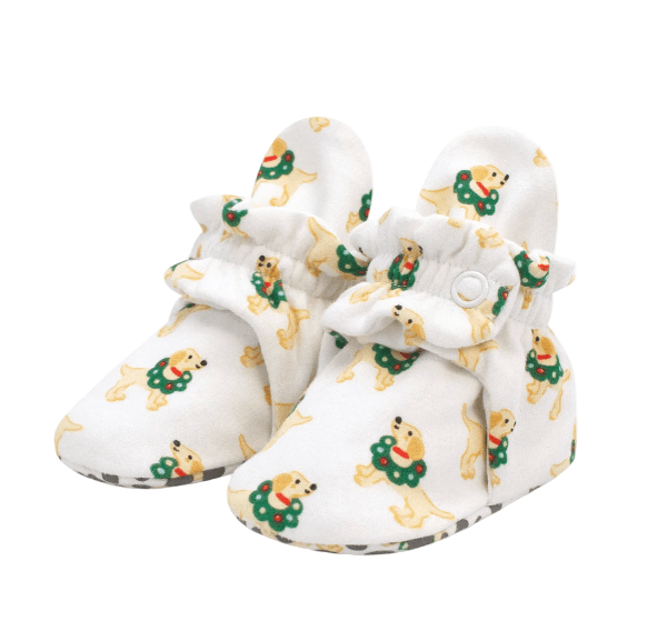 Baby booties with dog pattern on a white background