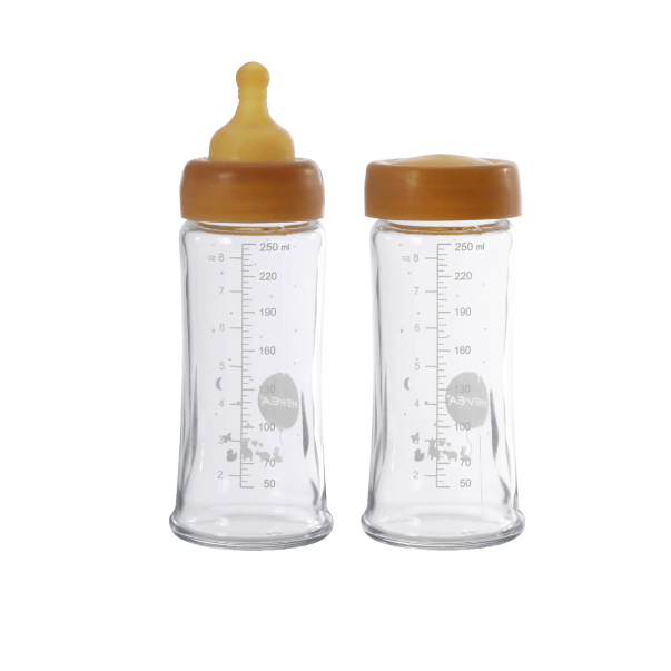 Two clear baby bottles with brown caps on a white background