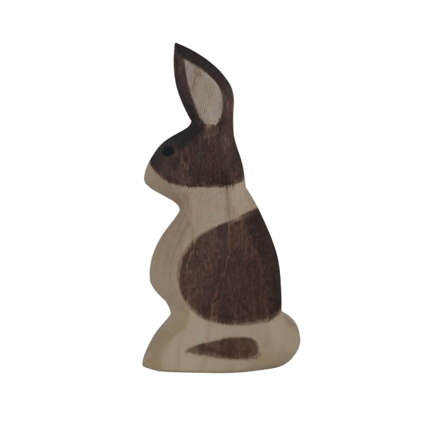 Wooden rabbit figurine on a white background