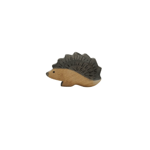 Wooden hedgehog figurine on a white background