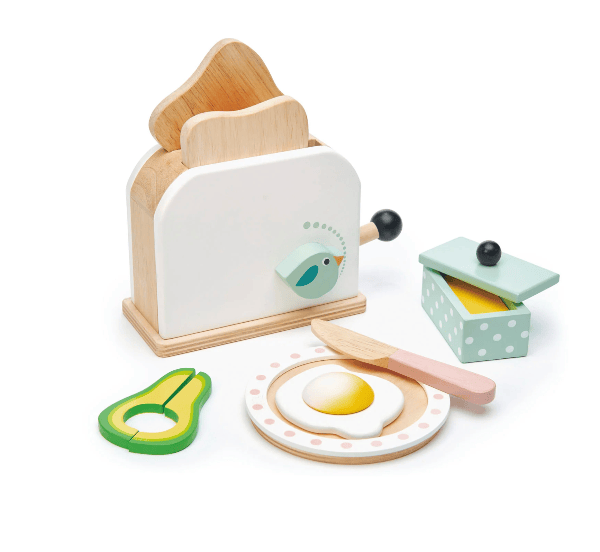 Wooden toy kitchen set with toaster, egg, knife, and avocado on a white background