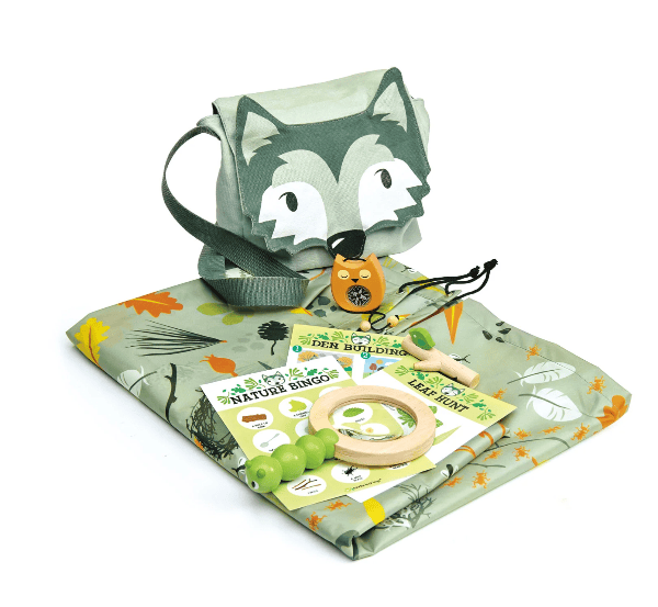 Children's play mat with fox design, toys, and books on a white background