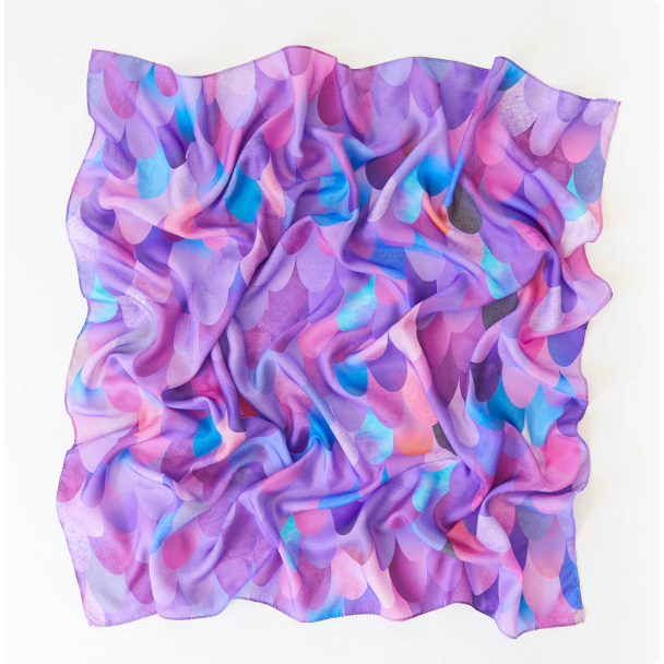 Multicolored fabric swatch with a swirling pattern on a white background
