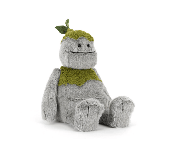 Plush toy resembling a creature with a green top hat and scarf on a white background