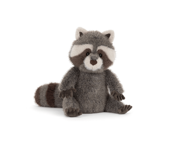 Stuffed raccoon toy on a white background