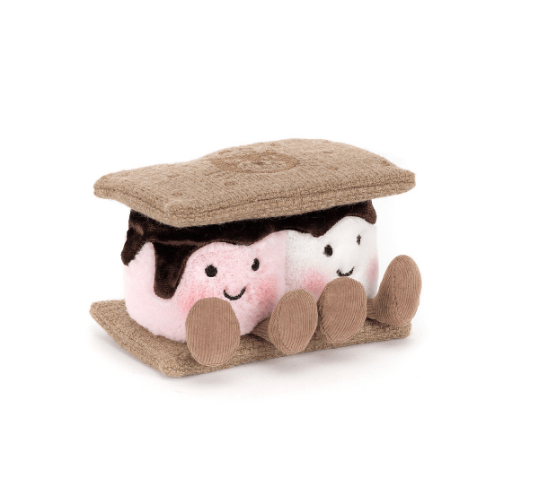 Plush toy resembling a marshmallow sandwich with a brown lid on a white background