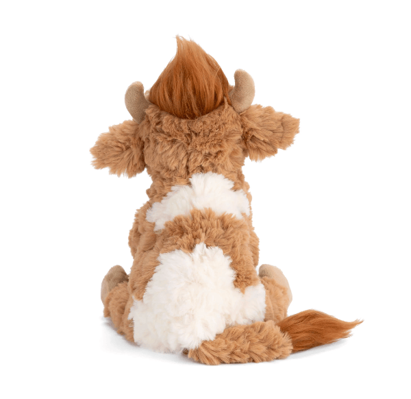 A plush toy cow shown from the back, featuring shaggy brown fur with a white stripe and horns, set against a plain white background.