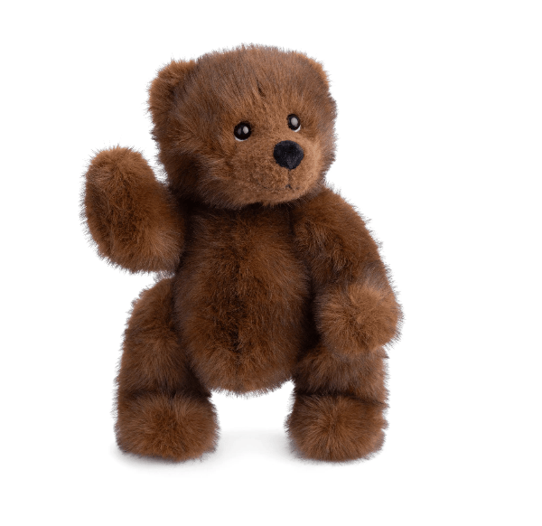 A brown plush teddy bear with soft, shaggy fur, black bead eyes, and a black stitched nose, standing on a white background with one paw raised in a waving gesture.