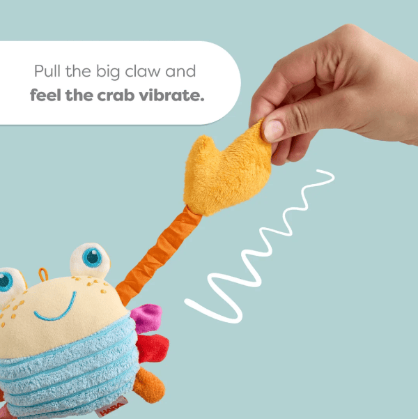 A hand pulls a plush crab toy, demonstrating its wavy vibration sound effect. The text overlay reads &
