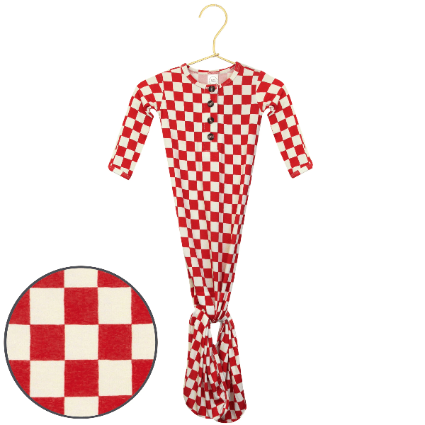 A red and white checkered long-sleeve baby gown with a button-down front and tie waist, shown on a hanger with a circular detail inset of the checkered pattern.
