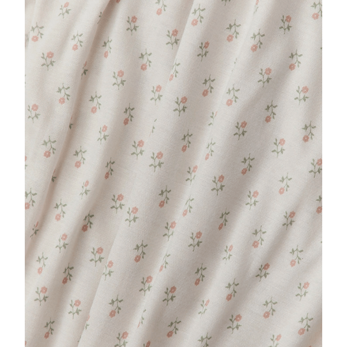 Floral patterned fabric with small flowers on a light background