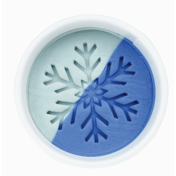 Round object with snowflake design in blue and white on a white background