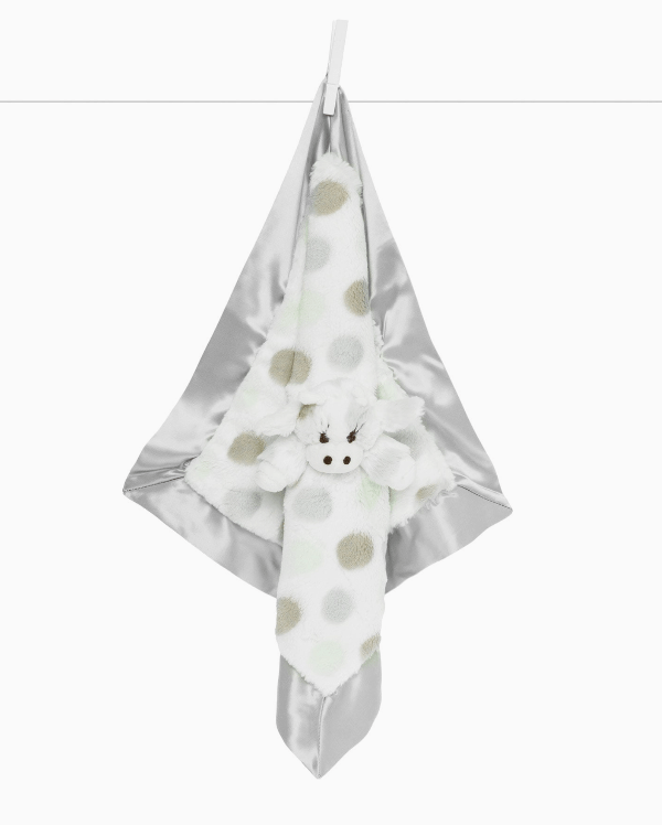 White towel with gray polka dots hanging on a white background