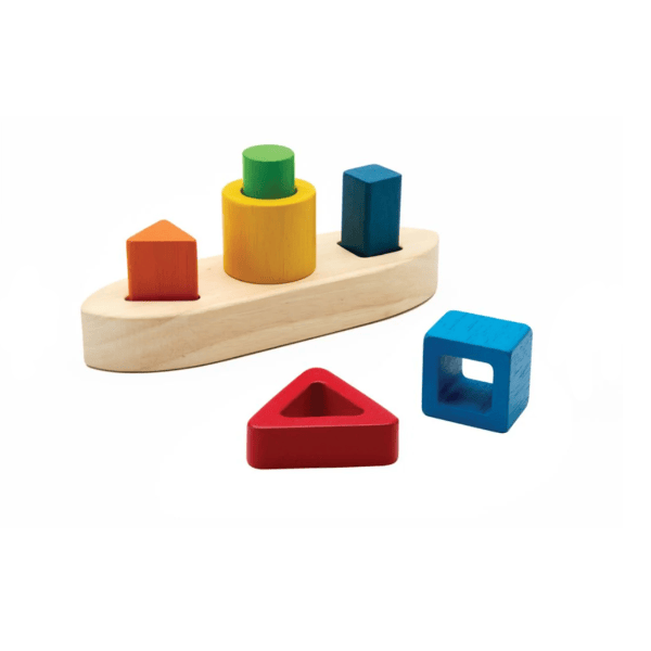 Wooden boat puzzle with multi colored stacked blocks.