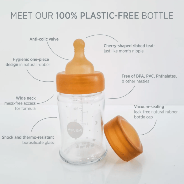 Plastic-free baby bottle with wooden nipple and cap on a white background