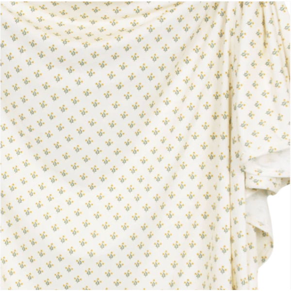White fabric with small yellow floral pattern