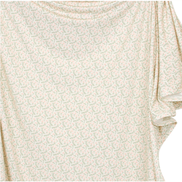 Close-up of a floral-patterned fabric with a light background