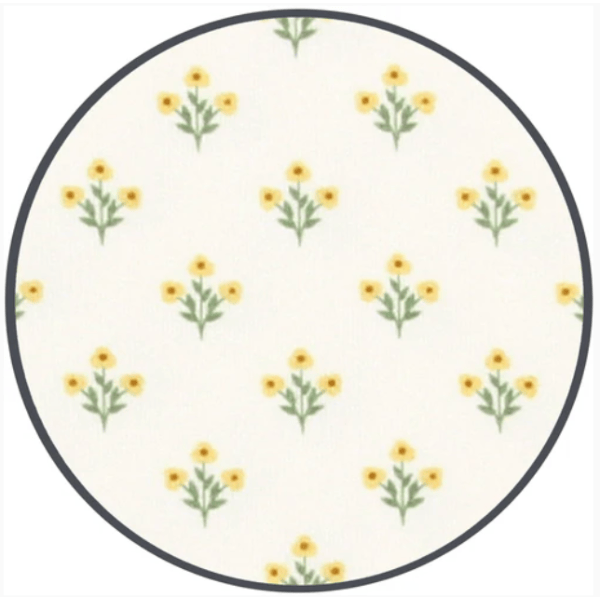 Round fabric swatch with yellow floral pattern on a white background