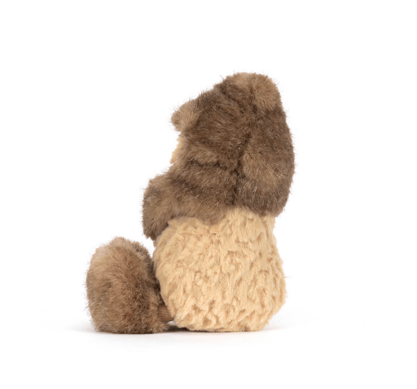 Stuffed animal toy resembling a peanut on a white background