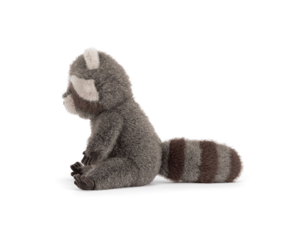 Stuffed animal raccoon toy on a white background