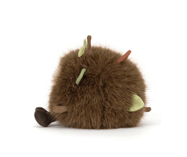 Plush toy resembling a brown creature with horns on a white background