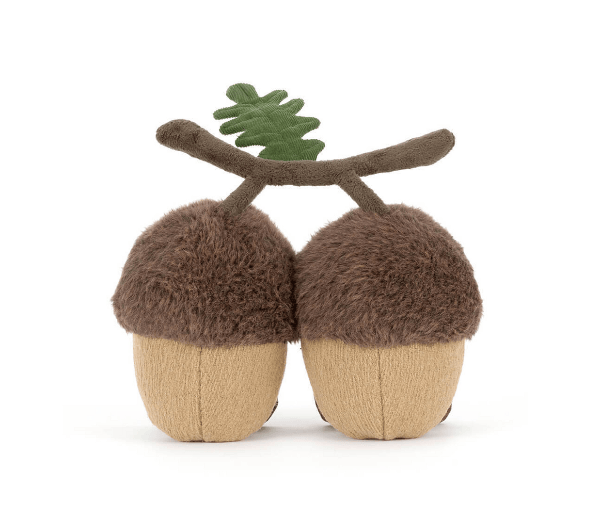 Pair of plush acorns with brown tops and beige bottoms on a white background