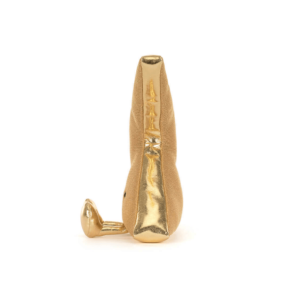 Gold stuffed animal on a white background