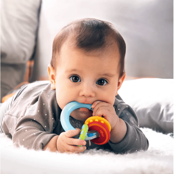 baby chewing on a teether